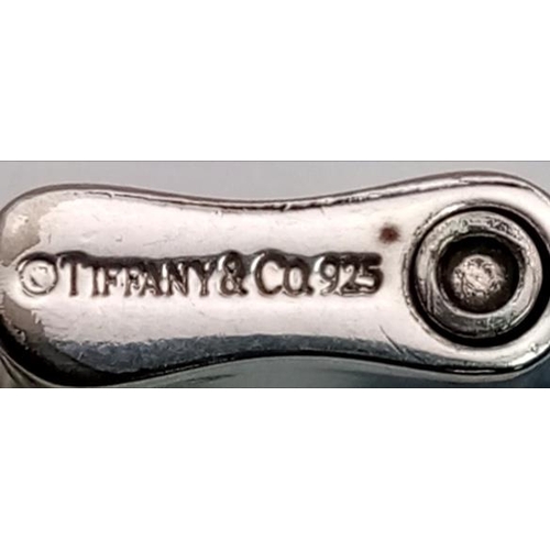 595 - A Tiffany and Co 925 Silver Double 1837 Padlock Bracelet. 18cm. 26.7g total weight.