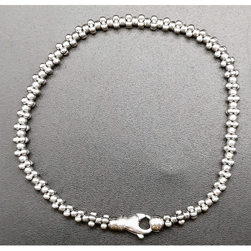 9 - An 18K White Gold Designer Ball-Link Bicego Bracelet.
18cm. 11.93g