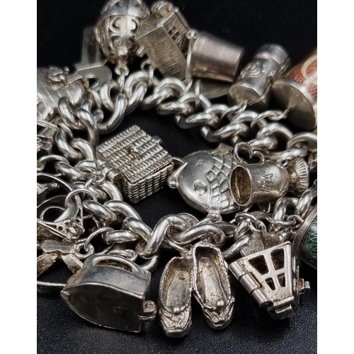 97 - A Wonderful Eclectic Silver Charm Bracelet. Some wonderful rare charms including a 10 shilling and 1... 