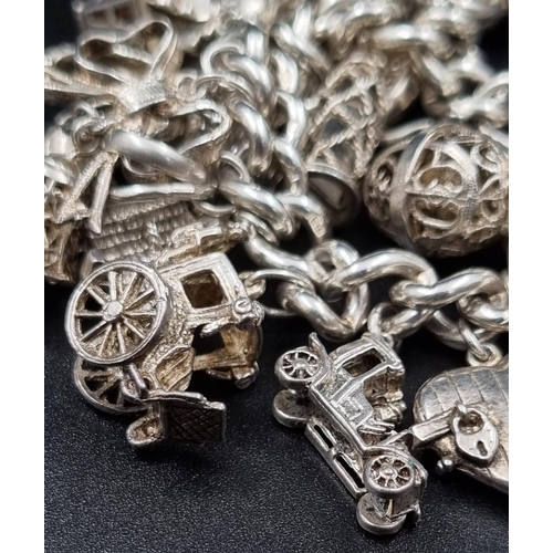 97 - A Wonderful Eclectic Silver Charm Bracelet. Some wonderful rare charms including a 10 shilling and 1... 