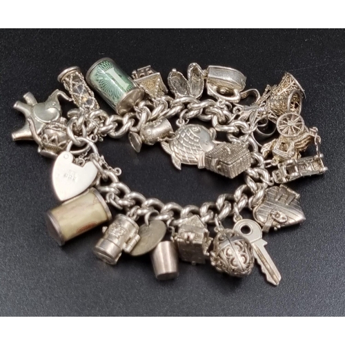 97 - A Wonderful Eclectic Silver Charm Bracelet. Some wonderful rare charms including a 10 shilling and 1... 