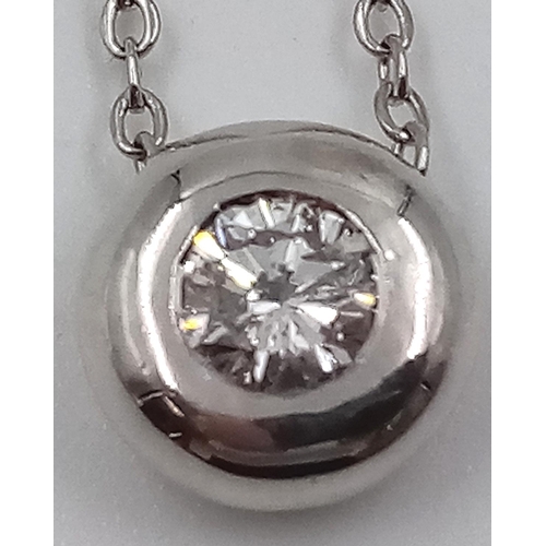 19 - An 18K White Gold Diamond Circular Pendant on an 18K White Gold Necklace. 0.55ct. 7mm and 42cm. 5.1g... 