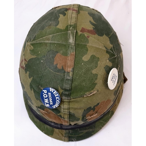 223 - Vietnam War Era US M1 Helmet and liner. Complete with a reversible Mitchel/Duck Hunter cover.