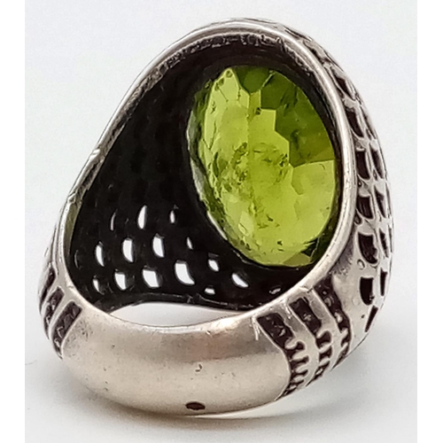 359 - A Vintage Breath-Taking 15ct Peridot Silver Ring. Large peridot encased in a pierced silver surround... 