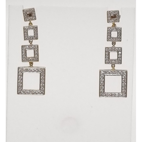 54 - A Pair of 18K Yellow Gold and Diamond Graduated Square Drop Earrings. 3.5cm drop. 2ct diamond weight... 