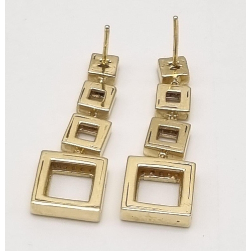 54 - A Pair of 18K Yellow Gold and Diamond Graduated Square Drop Earrings. 3.5cm drop. 2ct diamond weight... 