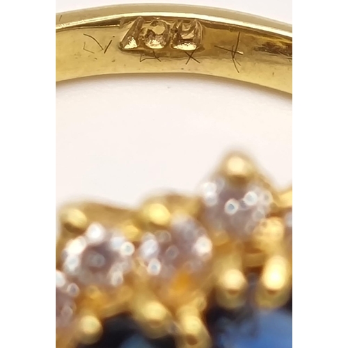 82 - A Gorgeous 18K Yellow Gold Sapphire and Diamond Ring. Seven clean sapphires surrounded by 18 small b... 