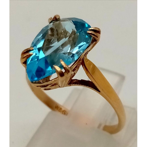 404 - 9ct yellow gold ring with impressive clear topaz centre stone, 13x8mm. Ring size O 1/2. Total weight... 