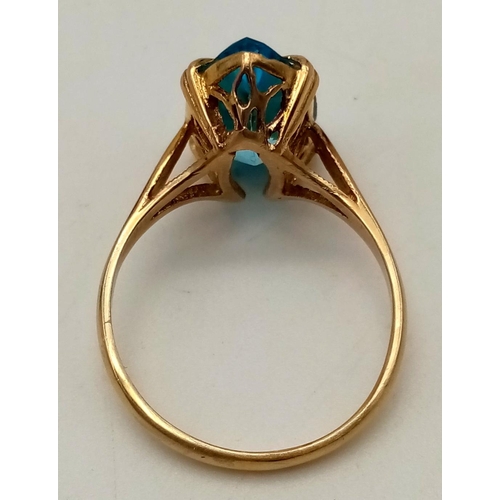 404 - 9ct yellow gold ring with impressive clear topaz centre stone, 13x8mm. Ring size O 1/2. Total weight... 