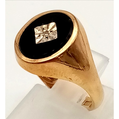 75 - A 9K Yellow Gold Diamond and Black Onyx Signet Ring.
Size P 1/2. 4.04g.