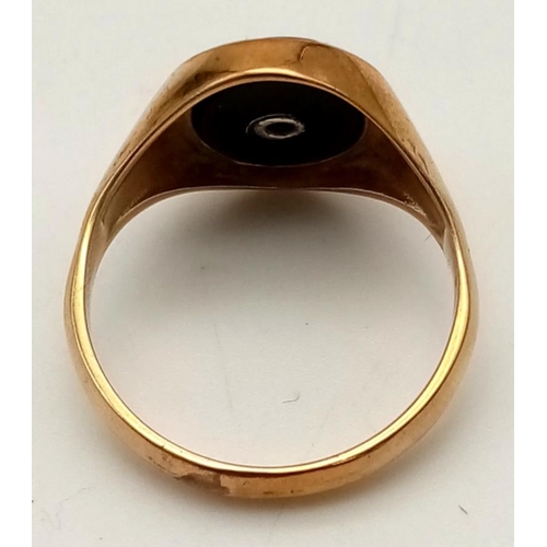 75 - A 9K Yellow Gold Diamond and Black Onyx Signet Ring.
Size P 1/2. 4.04g.