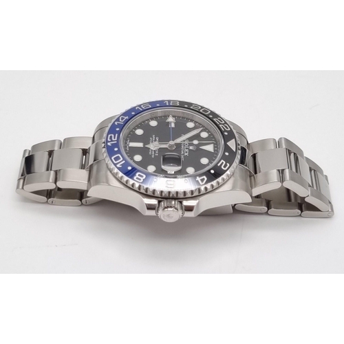 11 - A gents ROLEX GMT MASTER II. 42 mm dial with black face and blue bezel. In excellent/unused conditio... 