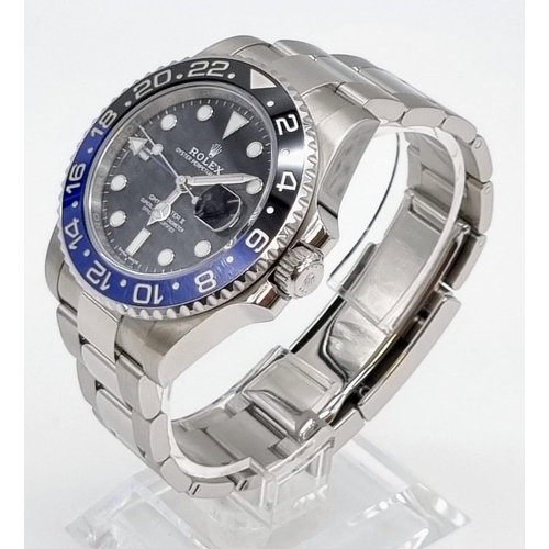 11 - A gents ROLEX GMT MASTER II. 42 mm dial with black face and blue bezel. In excellent/unused conditio... 