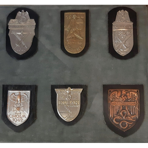 302 - A Vintage Framed and Glazed Collection of 10 German Third Reich Badges on leather backings (possible... 