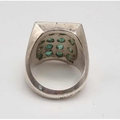 395 - A Vintage Natural 16 Stone Emerald Ring. Over 5ct of oval emeralds arranged in a rectangle -23 x 18m... 