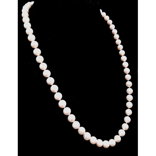 708 - A Natural Pearl Bead Necklace with an 18k Yellow Gold Clasp. 44cm. 6cm beads.