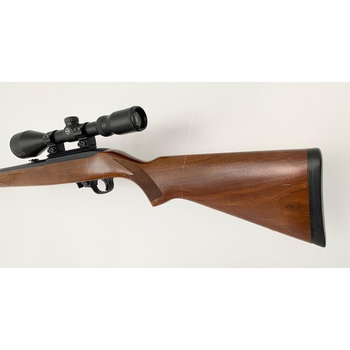 11 - A Ruger Model 10/22 Semi Automatic Rifle. Good wood stock. Fitted Hawk Sport HD 3-9X50 scope and mou... 