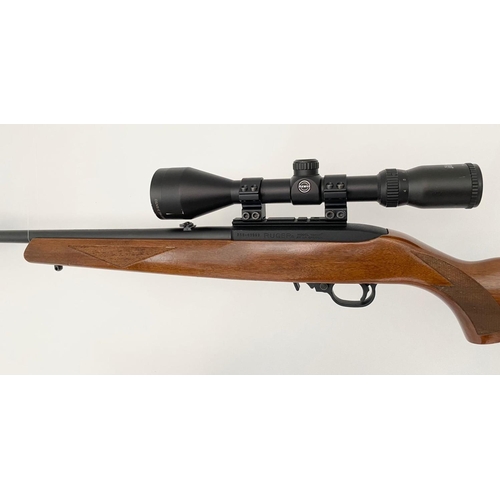 11 - A Ruger Model 10/22 Semi Automatic Rifle. Good wood stock. Fitted Hawk Sport HD 3-9X50 scope and mou... 