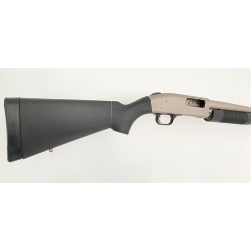 82 - A Mossberg 12 Gauge Pump-Action Shotgun. Stainless steel marine model. 7 plus 1 magazine.