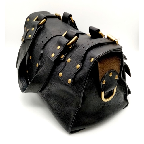 148 - A black leather MULBERRY bag with external pockets. Appr. dimensions: 34 x 19 x 28 cm Ref: 9350