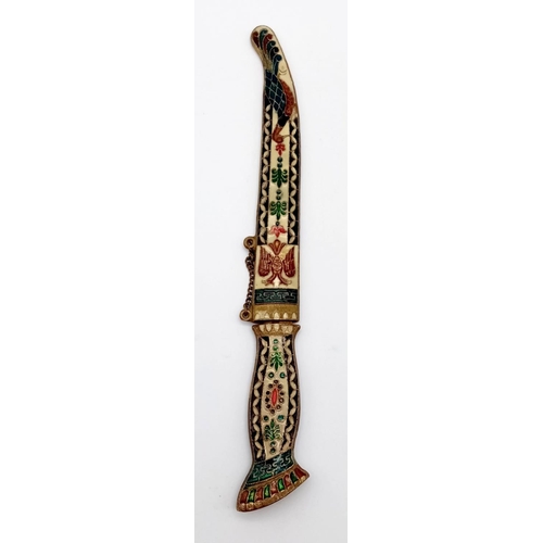 581 - Ornate dagger - see photos for finer details. Length: 25cm when sheathed