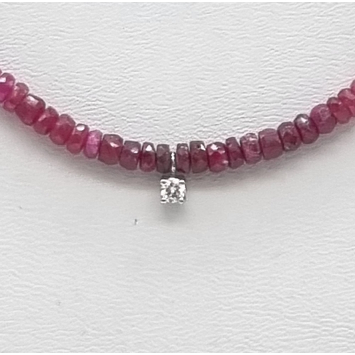 85 - A Natural Emerald, Ruby, Sapphire Gold and Diamond Necklace. Colourful beads with a small diamond mo... 