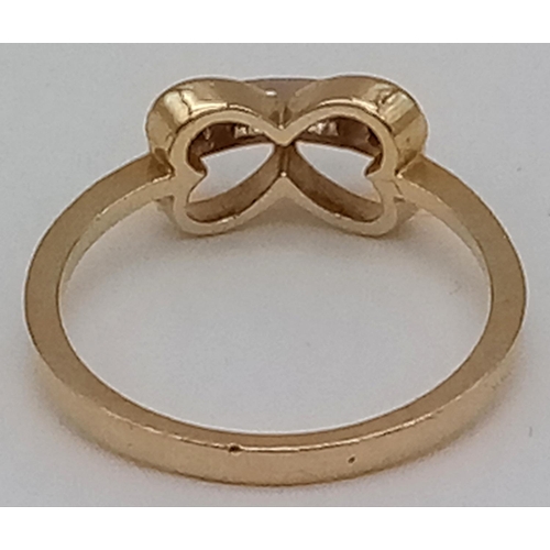 728 - 18K YELLOW GOLD DIAMOND SET BOW RING 2.3G SIZE M