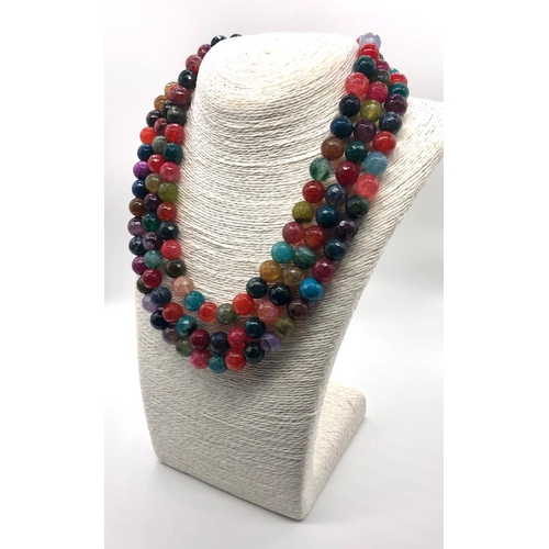 102 - A Dragon-Veined Multi-Colour Three-Row Agate Bead Necklace. Over 1300ct weight. 10mm beads. 42-46mm.