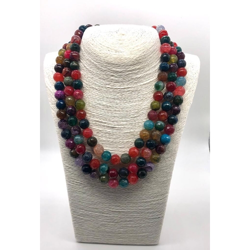 102 - A Dragon-Veined Multi-Colour Three-Row Agate Bead Necklace. Over 1300ct weight. 10mm beads. 42-46mm.