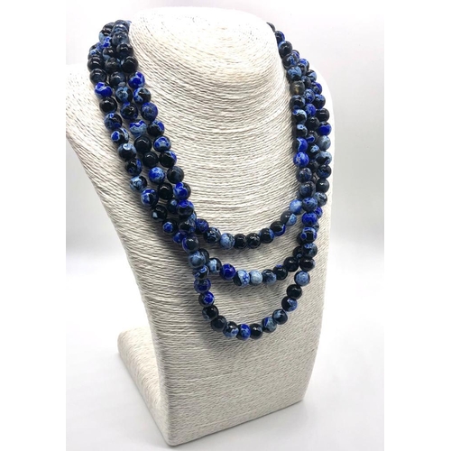 298 - A Dragons Vein Shade of Blue Agate Three-Row Necklace. Over 1000ct weight. 10mm beads.