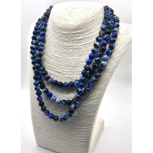 298 - A Dragons Vein Shade of Blue Agate Three-Row Necklace. Over 1000ct weight. 10mm beads.