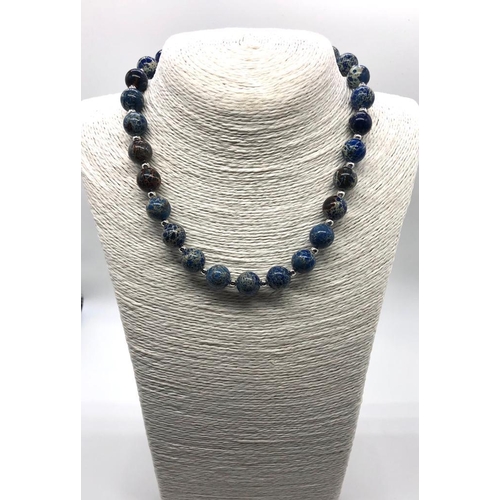 409 - A Blue Sea Sediment Jasper Beaded Necklace. 12mm beads. 40cm. T-bar clasp.