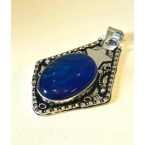 579 - A Blue and an Orange Opalite Pendant set in 925 Silver plated Metal.