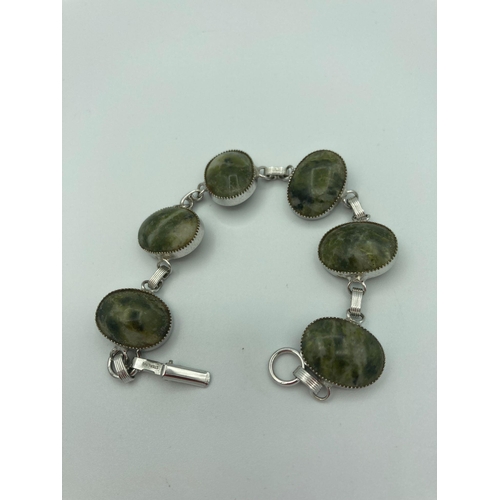 369 - SILVER BRACELET set with Siberian SÉRAPHINITE .
Comprising six gemstones individually mounted in Sil... 