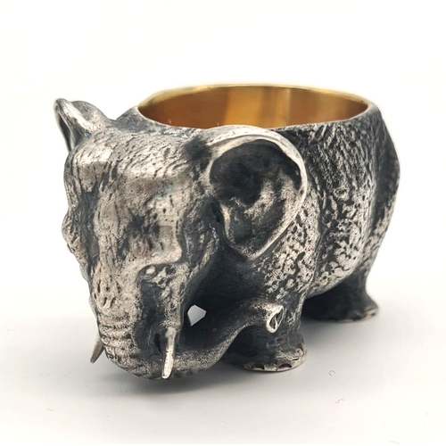 1195 - Russian gild solid silver elephant salt. Hallmarked to the base. 5cm x 3cm. Weight: 128 grams.