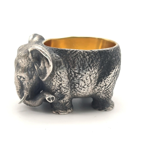 1195 - Russian gild solid silver elephant salt. Hallmarked to the base. 5cm x 3cm. Weight: 128 grams.