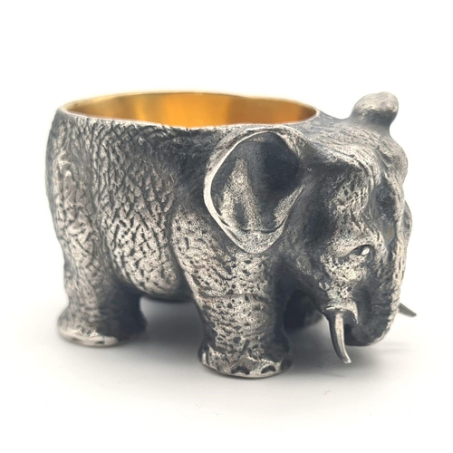 1195 - Russian gild solid silver elephant salt. Hallmarked to the base. 5cm x 3cm. Weight: 128 grams.