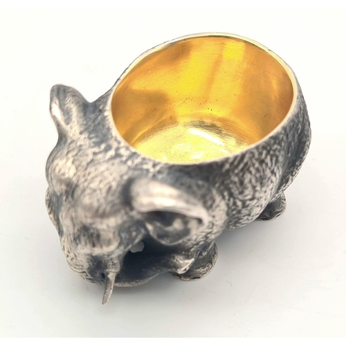 1195 - Russian gild solid silver elephant salt. Hallmarked to the base. 5cm x 3cm. Weight: 128 grams.