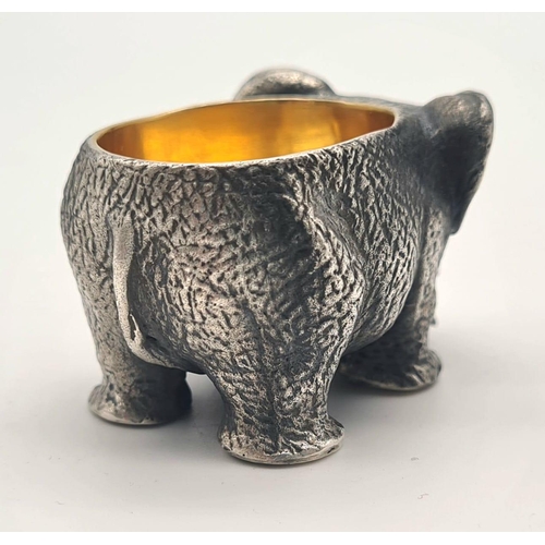 1195 - Russian gild solid silver elephant salt. Hallmarked to the base. 5cm x 3cm. Weight: 128 grams.