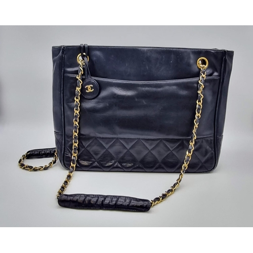 221 - A vintage blue leather CHANEL handbag. Appr. dimensions: 28 x 8  x 22 cm. REF: 9334