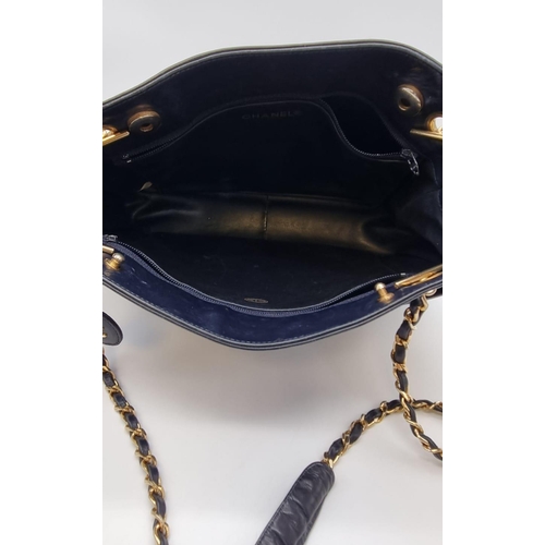 221 - A vintage blue leather CHANEL handbag. Appr. dimensions: 28 x 8  x 22 cm. REF: 9334