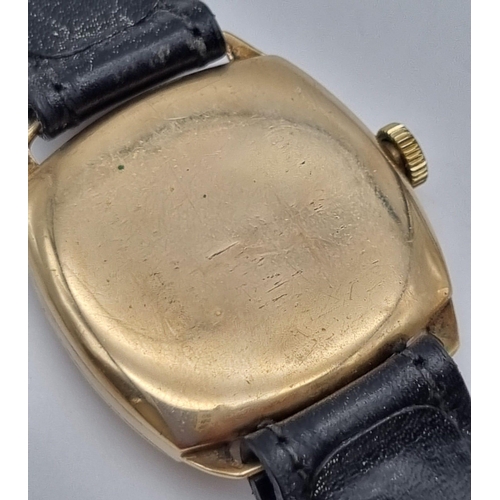 79 - A Beautiful 1930s Omega 9K Gold Cushion Watch. Black leather strap with a 9K gold case - 30mm. Gold ... 