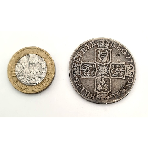 205 - A Queen Anne 1708 Half Crown Silver Coin. 14.62g. 34mm diameter. Please see photos for conditions.