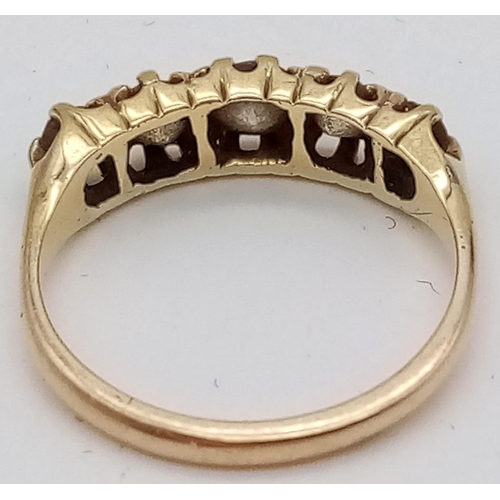 619 - An 18K Yellow Gold and Five Diamond Ring. Size N. 0.5ct
3.2g total weight.