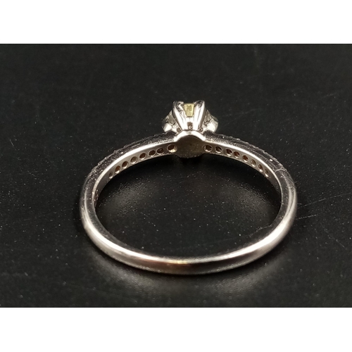 696 - A 9K White Gold Diamond Ring. Central diamond with diamonds on shoulders. 0.35 and 0.20ct. Size O.
1... 