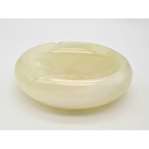 1194 - A Vintage Green Onyx Ashtray. 12cm diameter.