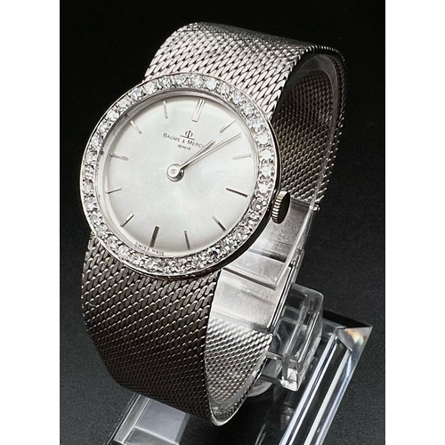 220 - An 18 K white gold BAUME & MERCIER ladies watch. 24 mm dial, bezel with brilliant cut diamonds. Manu... 