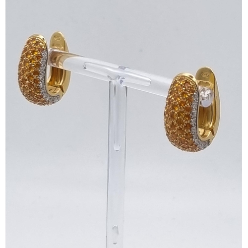 422 - A 19 K yellow gold pair of earrings with diamonds and citrine. Height: 20 cm, total weight: 17.35 g.