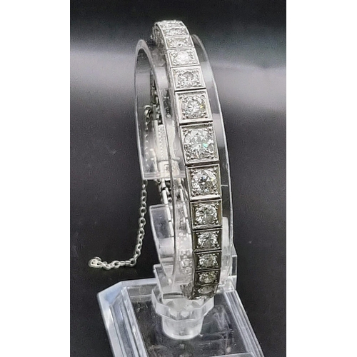 74 - A platinum tennis bracelet with large brilliant cut diamonds. Length: 18 cm, weight: 31.67 g.