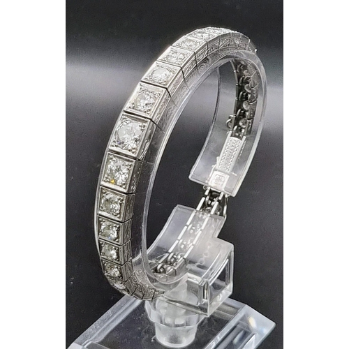 74 - A platinum tennis bracelet with large brilliant cut diamonds. Length: 18 cm, weight: 31.67 g.